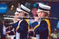 selective focus photography of people holding clarinets